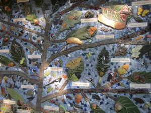 Ceramic mural on public toilets next to Peter J Shields oak grove.