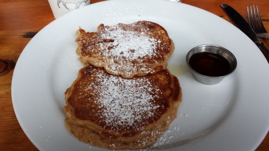 Whole wheat pancakes with strawberries throughout makes for yummy goodness.