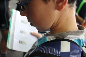 Young fan systematically collects autographs.