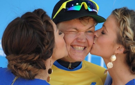 Enjoying the perks of victory with a huge smile and a wink!