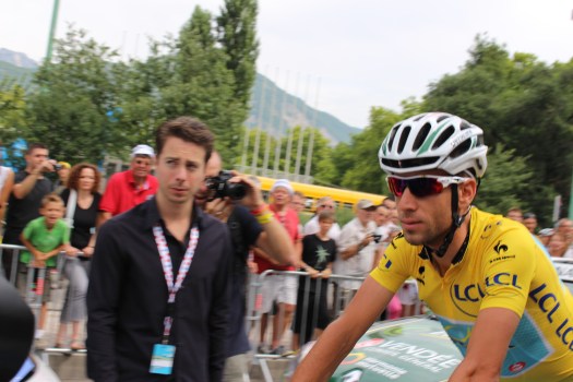 Ultimate 2014 winner Vincenzo Nibali heads to the starting line wearing the yellow jersey.