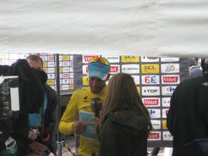 The race leaders run the gauntlet of news reporters after each stage.