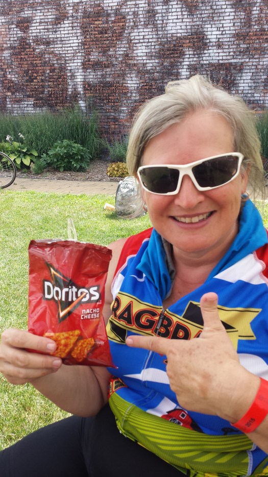 Take a bag of nacho doritos and add seasoned hamburger, lettuce, cheese, sour cream and salsa. 