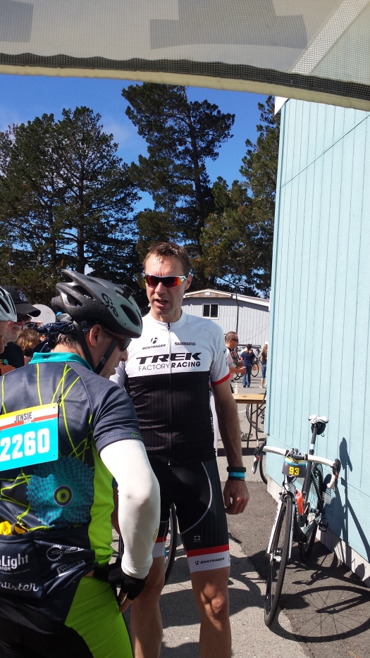 Jens Voigt talking to riders and fans about his bike.
