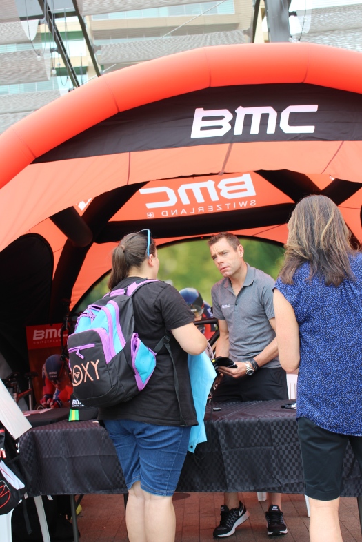 Signing autographs at BMC booth.